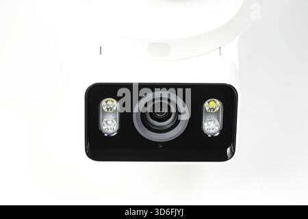 close-up shot lens of home security camera on white background. Stock Photo