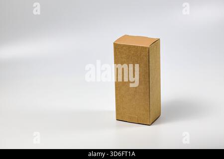 Rectangle Cardboard box for Parcel Delivery isolated on white background. Stock Photo