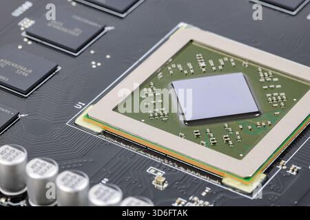 Close up modern printed circuit Board with Advanced Graphic Processing Unit.  Electronic Devices Production. Stock Photo