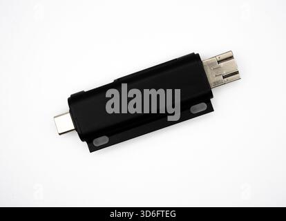 Black USB flash drive isolated on white background. Digital storage concept for data transfer, backup, technology, security and office work.  Stock Photo