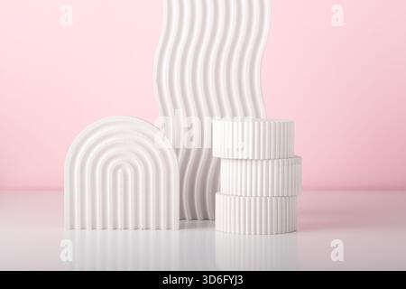 White concrete advertising stands. Gypsum podium for the presentation of cosmetic products. Minimal mock up. Stock Photo