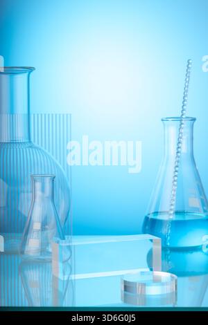Science and medical background with lab glassware filled blue liquid and ribbed acrylic sheet decorated on light blue background. Space for products p Stock Photo