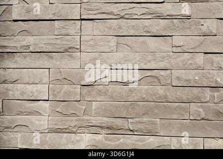 Stone wall texture with modern stacked tiles Stock Photo