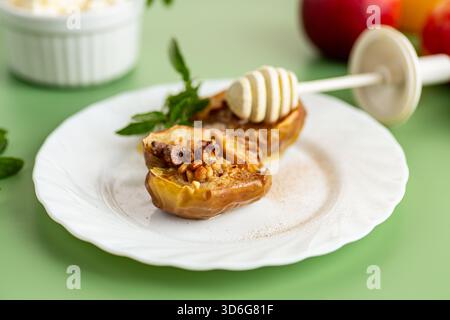 Healthy baked apples stuffed with nuts and aromatic spices. Stock Photo