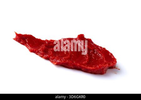 A smear of red tomato paste isolated on white background. Stock Photo