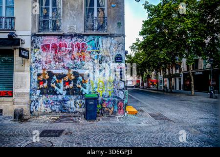 Colourful street art and graffiti on a building wall in the Marais district of Paris, France. Stock Photo