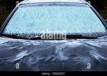 Frost Patterns on Car. A car covered in intricate frost patterns on a cold morning, Stock Photo