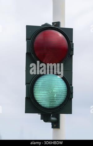 Traffic light with barrier gate work. Traffic lights with two colors on, red and green. Italy Stock Photo