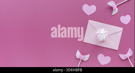 Pink hearts, toppers, envelope with letter on pink background. Valentine's day banner. Romantic, Valentines concept Flat lay, top view, copy space Stock Photo