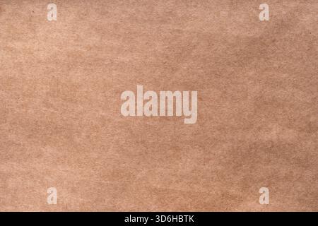 Textured craft surface. Brown paper sheet texture background or cardboard surface from box for packing. Pressed beige chipboard. Old brown recycled ec Stock Photo