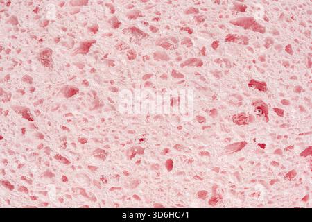 Sponge pink texture background. Bath spongy surface. Kitchen sponge material closeup. Foam rubber detail. Close up, macro Stock Photo