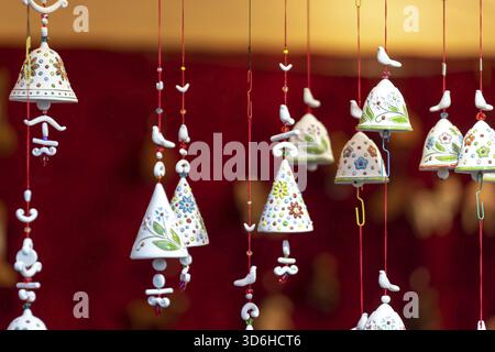Hand made decorations at Christmas market in Europe. Buying presents and gifts in street market. Holiday shopping. Selective focus Stock Photo