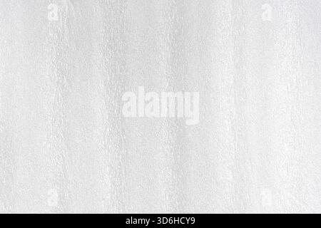 Foam white plastic texture. Styrofoam abstract grey surface with grain structure. Synthetic material for packing. Horizontal view, close up, macro Stock Photo
