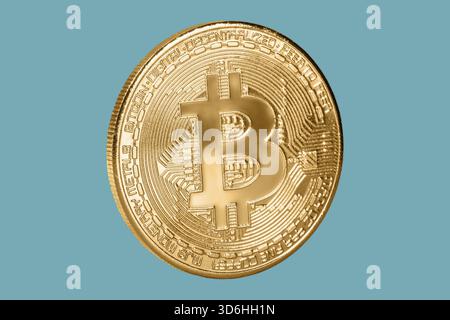 Bitcoin coin isolated on blue background. Cryptocurrency, virtual money. Blockchain technology, bitcoin mining concept Stock Photo