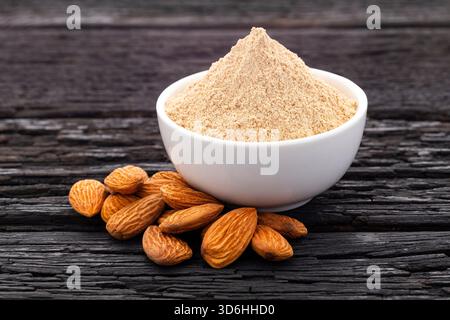 Crushed almonds in a bowl - Organic raw almond flour Stock Photo