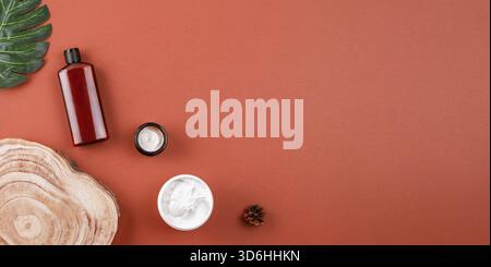 Natural cosmetics on brown surface, skincare mockup products flat lay. Facial cosmetic products layout, top view, banner. Beauty and skin care concept Stock Photo