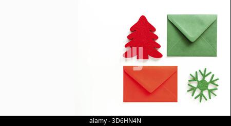 Set of christmas envelopes and felt decoration on white. Banner design, top view, flat lay, copy space Stock Photo