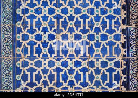 Detail of typical blue tile mosaic pattern design on a wall. At the Tash Khauli Palace in the old walled city, Ichan Kala. In Khiva, Uzbekistan. Stock Photo