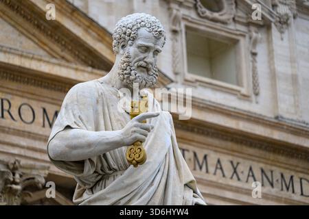 The statue of Saint Peter (by Giuseppe De Fabris,1840) in front of Saint Peter's Basilica in the Vatican (Rome). Stock Photo