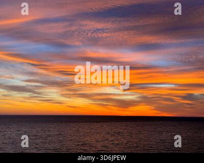 Sunset dramatic sky over sea Stock Photo
