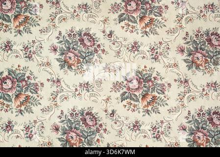 Seamless old-fashioned floral pattern on a tapestry fabric texture biege background. Old retro fashion Stock Photo