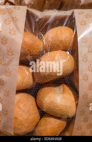 The image shows texture and color of the baked goods in retail presentation. Suitable for articles about food markets and bakery products. Stock Photo