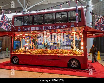 Festive Great British Fudge Company red double decker bus serving sweets at the Christmas display, Midsummer Place, Milton Keynes, UK Stock Photo