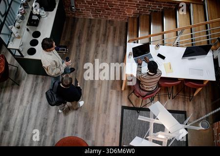 Young Adult Multiethnic Colleagues Collaborating in Modern Business Office Stock Photo