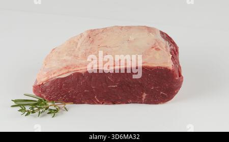 Fresh beef with fat and rosemary isolated nature background with clipping path Stock Photo