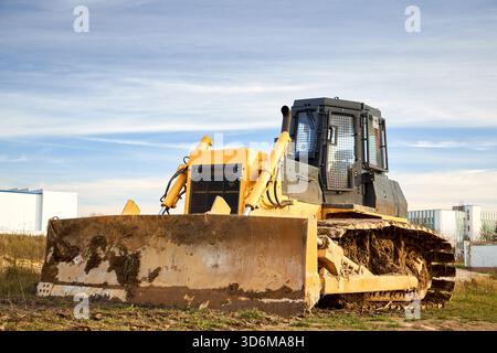 A front loader moves soil at an excavation site where the Argentine ...