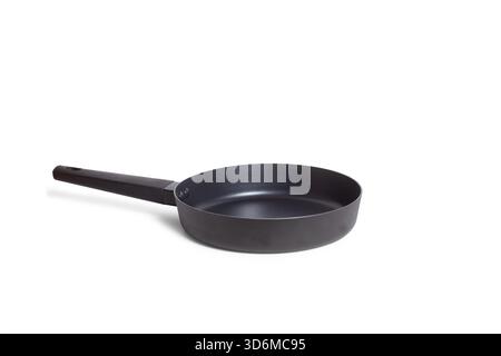 A black frying pan on a white background with copy space Stock Photo