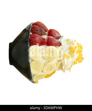 Korean Bingsu in small black bowl with several fruits topping is isolated on white background with clipping path. Stock Photo