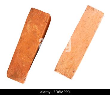 Side view of two cracked old red or orange bricks in set is isolated on white background with clipping path. Stock Photo