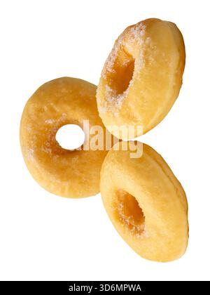 Side view of three brown sugar glazed cinnamon donuts in stack is isolated on white background with clipping path. Stock Photo