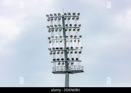 Photograph of numerous floodlight heads in the top section of a large lighting system at a sports stadium arena in Sydney in NSW, Australia. Stock Photo