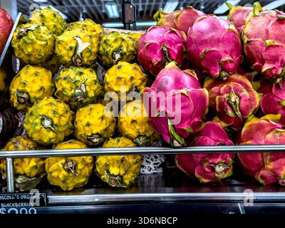 Red Dragonfruit and Yellow Dragonfruit in a grocery store, New York City, NY, USA Stock Photo