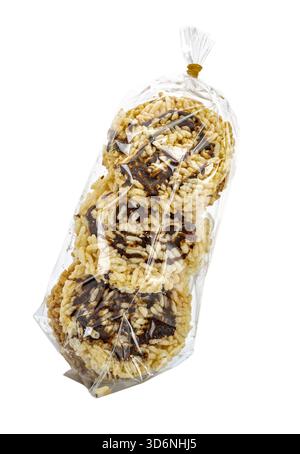 Packaging of round rice crackers with Simmered cane sugar inside a clear plastic bag sealed with a rubber band. The snacks appear crispy, light, and r Stock Photo