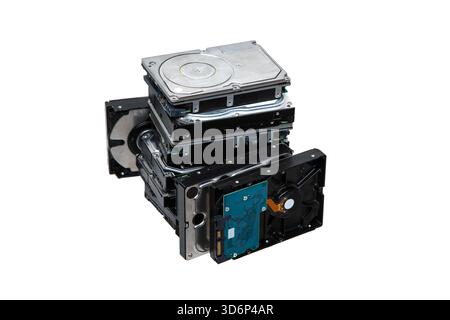 A large stack, pile  of internal computer hard disk drives, HDDs, isolated on a white background. Stock Photo
