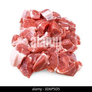 An overhead close-up of a pile of raw, diced pork shoulder chunks, showing marbling and a white fat cap, isolated on white. High quality photo Stock Photo