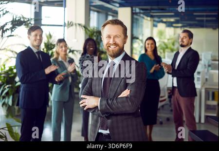 Happy young businessman in formal suit portrait, smiling confident guy posing for photo Stock Photo
