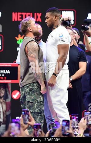 Jake Paul and Anthony Joshua face the media during the press conference ...