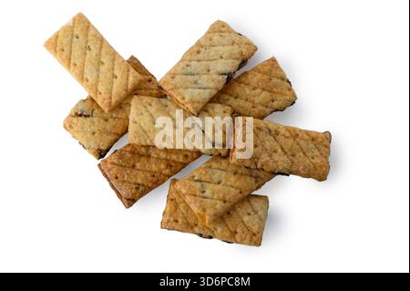 Golden-brown puff pastry triangles filled with sweet raisin mixture, isolated on white. The delicate, buttery layers and visible fruit filling create Stock Photo