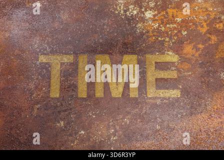 Rusty metal plate word "TIME" Extensive corrosion, featuring orange and brown hues with coarse, textured appearance artistic or industrial piece, Stock Photo