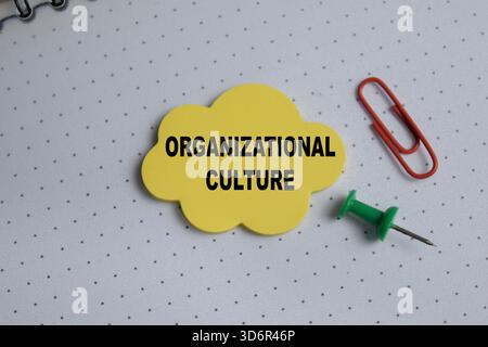 Concept of organizational culture write on sticky notes isolated on Wooden Table. Stock Photo