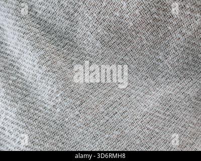 Light gray textured fabric close-up showing intricate weave patterns Stock Photo