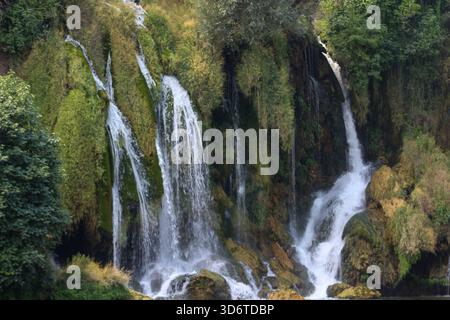 Kravice Waterfall in Herzegovina captured on August 24, 2025. Lush greenery surrounds cascading streams forming a scenic natural landscape. Stock Photo