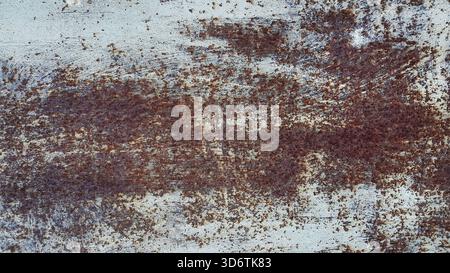 Texture of a painted metal wall covered with rust from time and weather conditions Stock Photo