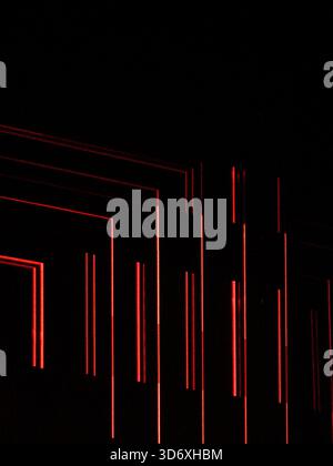 Dynamic red light lines in an abstract pattern on a black background, representing concepts of digital data, futuristic technology, and modern network Stock Photo