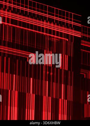 Abstract red laser light creating a grid pattern and vertical lines, representing data, computation, technology, science, and a futuristic digital con Stock Photo