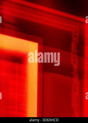 Abstract red and orange lights creating a geometric pattern with overlapping translucent lines and textured surfaces, forming a dynamic modern backgro Stock Photo
